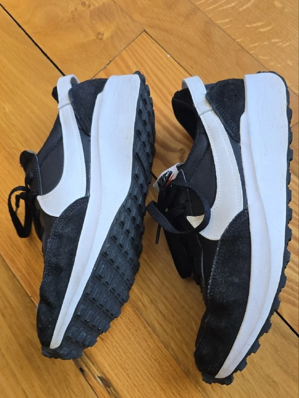 Nike Waffle Debut sneakers featuring a black nylon and suede upper with a white